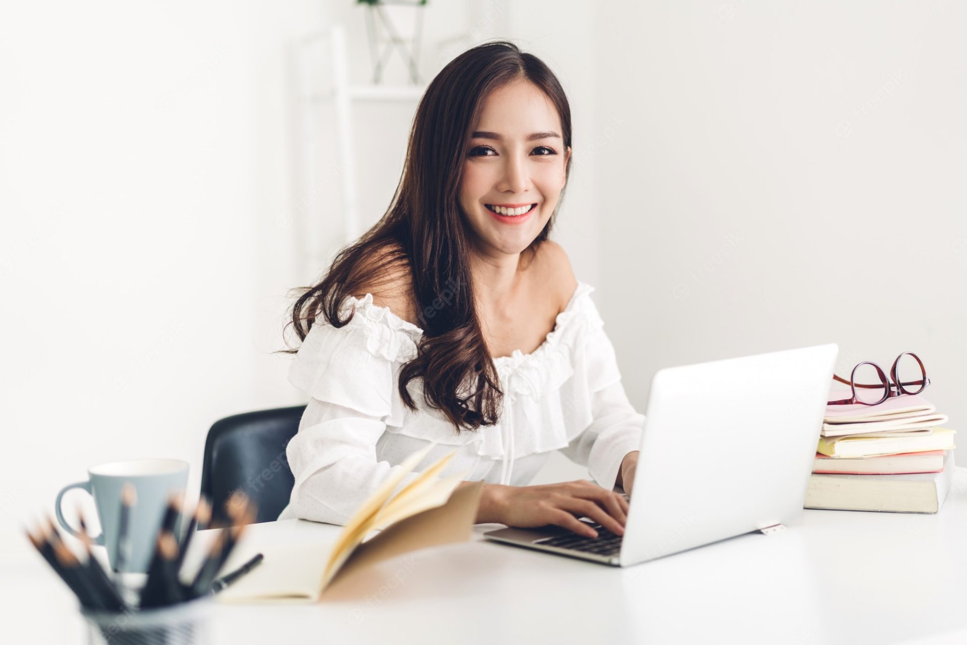 girl-student-sitting-studying-learning-online-with-laptop-computer-reading-book-before-exam-home-education-concept_38019-1414
